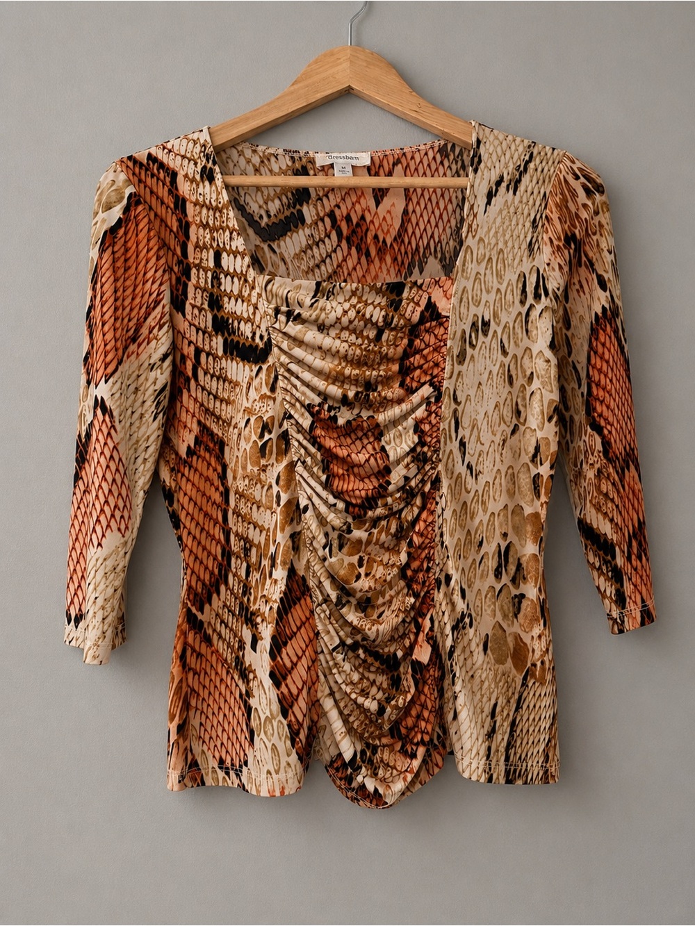Flattering ruched front animal print top with stretch comfort and vibrant